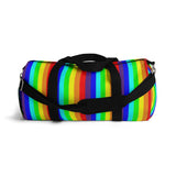 rainbow candy stripe duffle bag with stay curious, be wonderful. in pink.