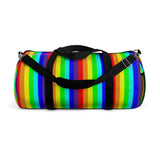 rainbow candy stripe duffle bag with stay curious, be wonderful. in pink.